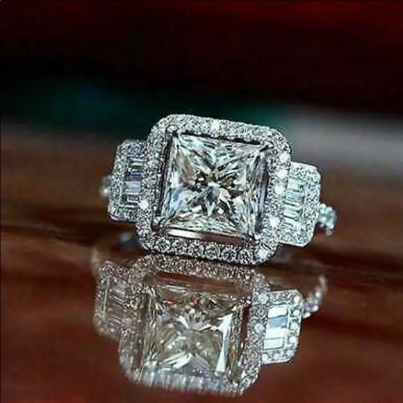 Platinum plated ring with Cubic zirconia as main stone and crystals surrounding - Picture 1 of 6